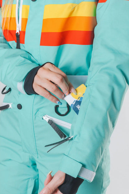 The Midday Aprés | Teal and Orange Retro Stripe Women's One Piece Ski Suit